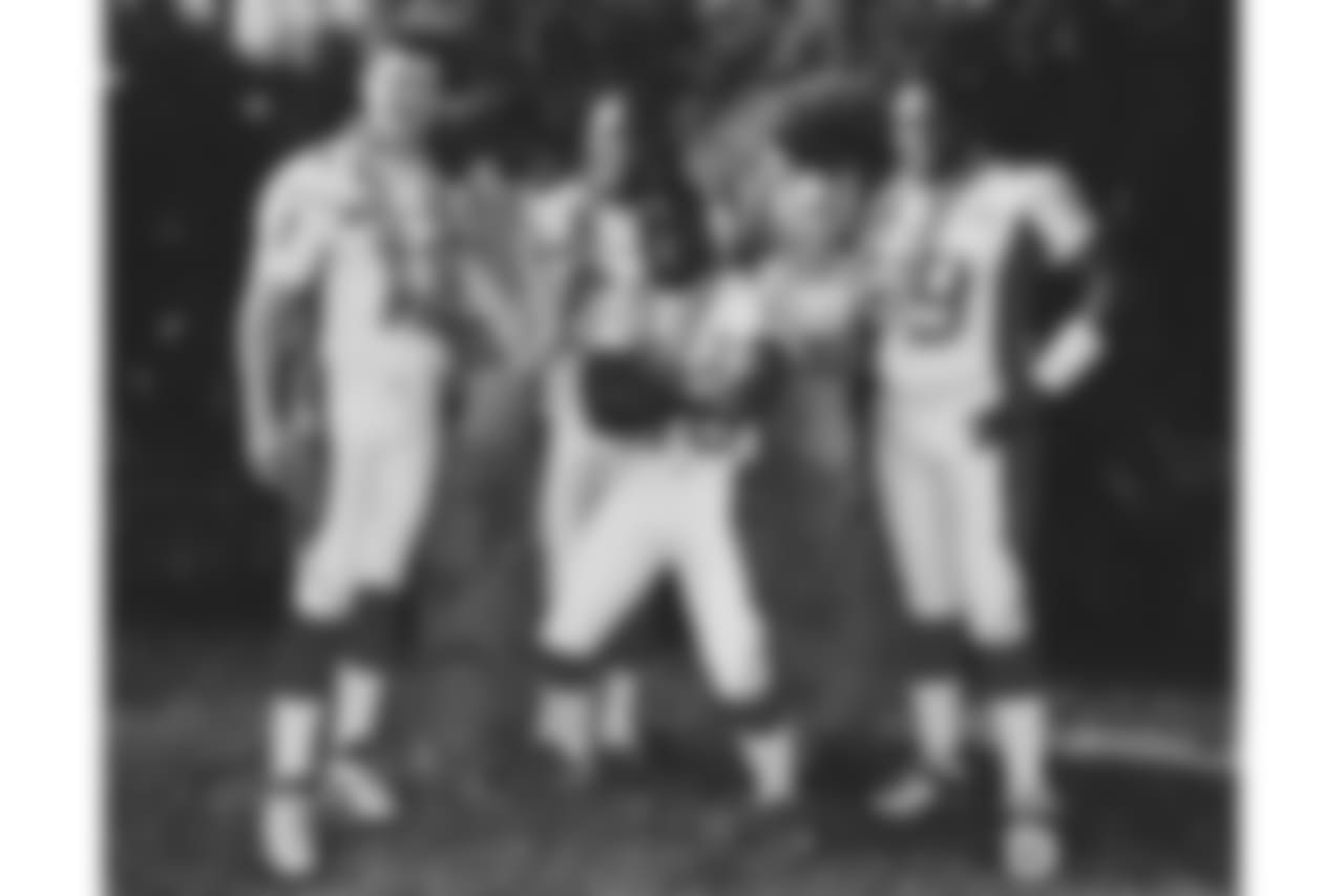 QB Drew Bledsoe, WR Eric Moulds, RB Travis Henry (front), G Ruben Brown (2002)