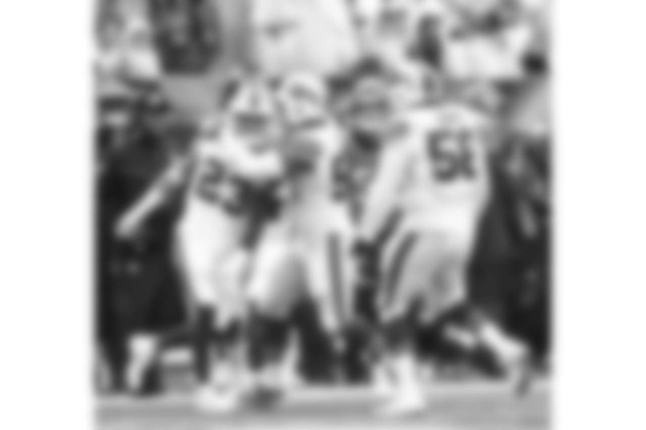 Safety Micah Hyde (No. 23) celebrates an interception with teammates - Week 5 vs. the Bengals