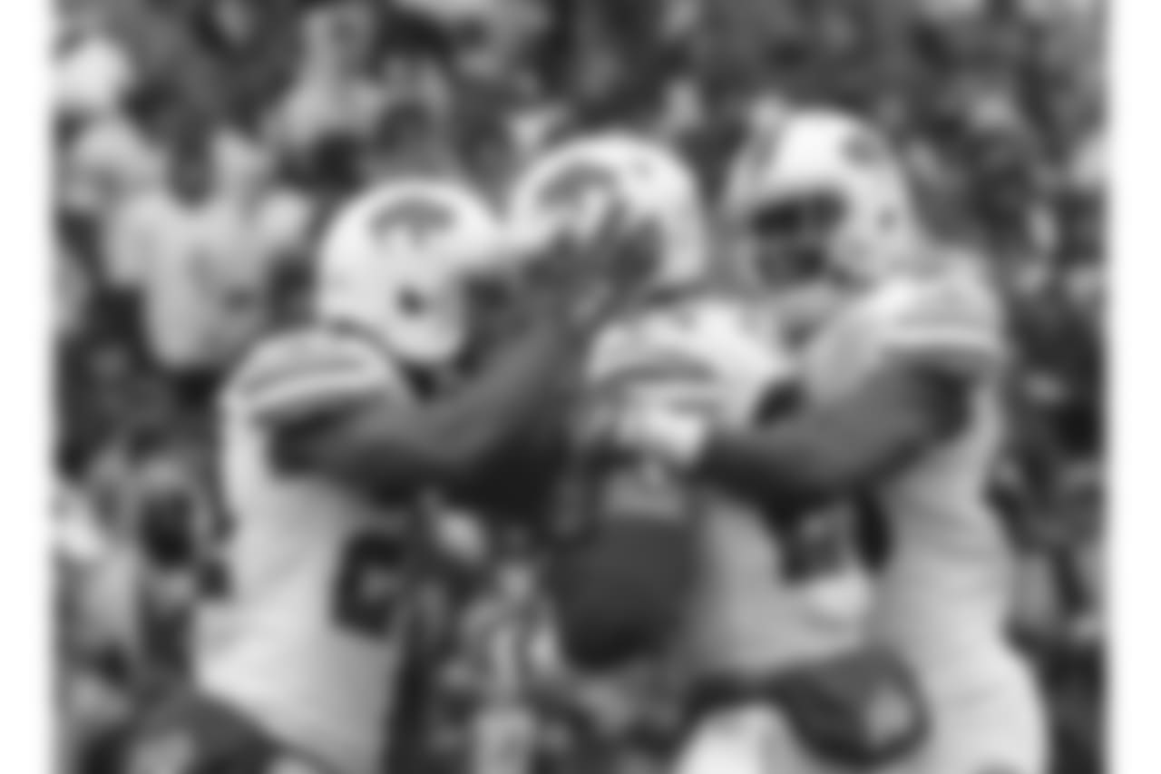 Safety Micah Hyde (No. 23) and teammates - Week 8 vs. the Oakland Raiders