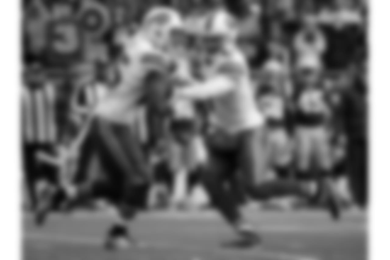 QB Tyrod Taylor (No. 5) hands the ball off to RB LeSean McCoy (No. 25)