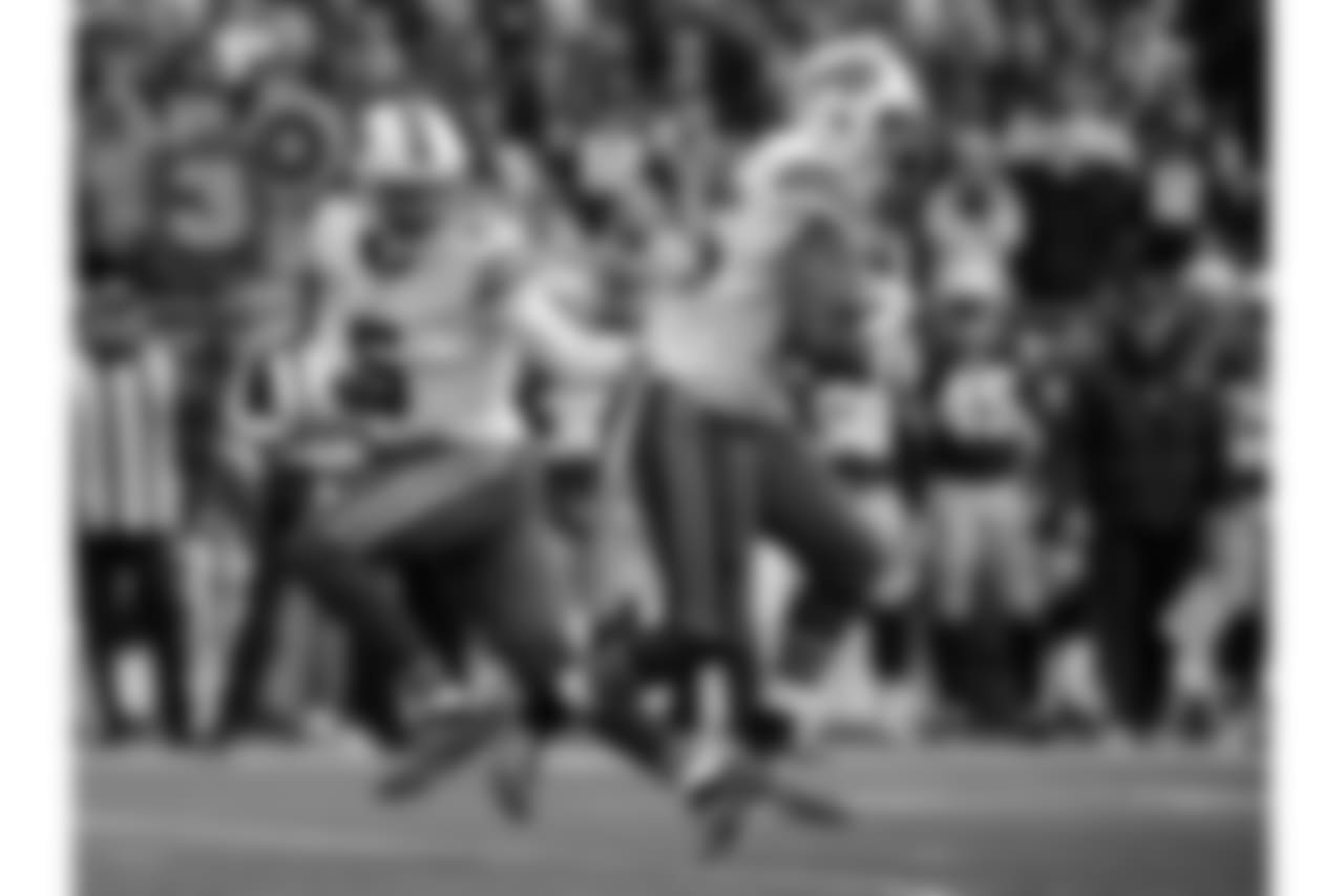 QB Tyrod Taylor (No. 5) hands the ball off to RB LeSean McCoy (No. 25)
