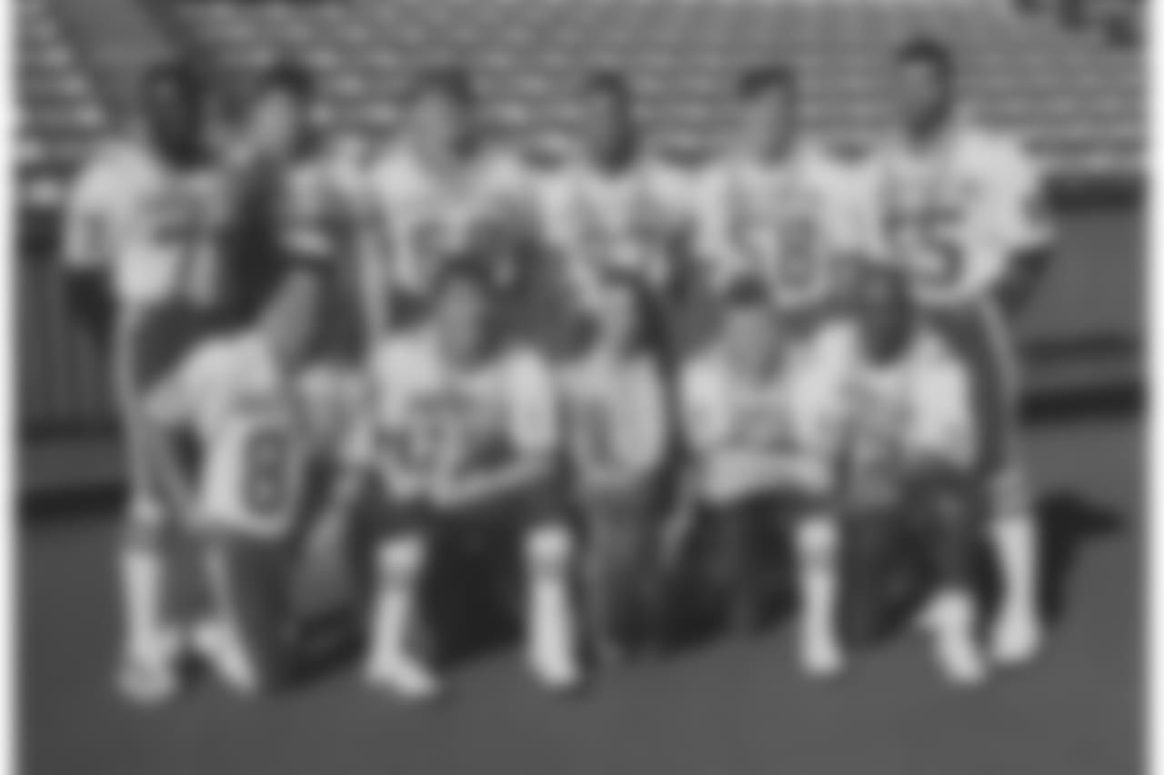 Back Row (L to R): DE Bruce Smith, C Kent Hull, T Will Wolford, LB Cornelius Bennett, LB Shane Conlan, LB Darryl Talley. Front Row (L to R): WR Andre Reed, QB Jim Kelly, WR Steve Tasker, RB Thurman Thomas (1990).