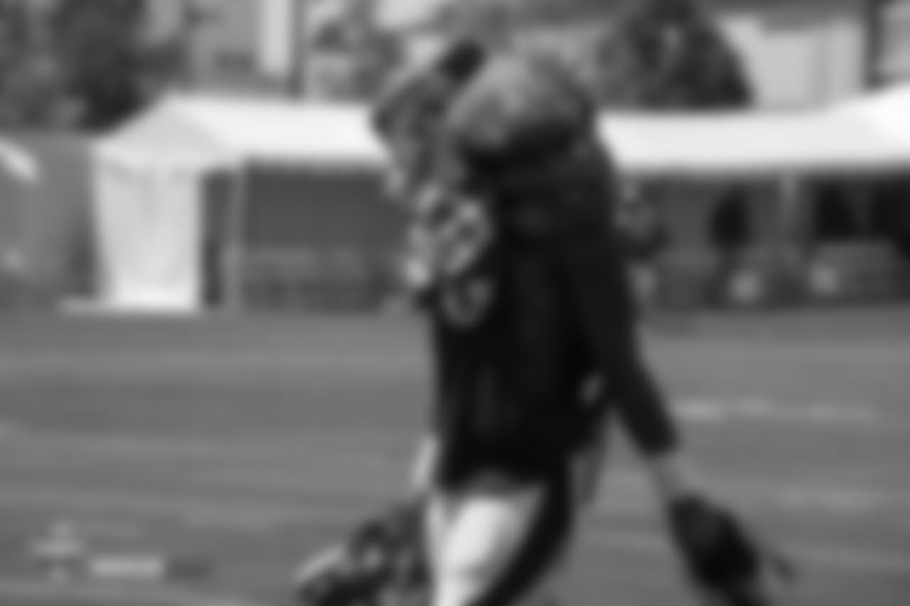 Wide receiver Courtland Sutton (14) carries extra pads on his shoulders, nearly covering his entire head, during the ninth day of training camp on August 7, 2018, at UCHealth Training Center.