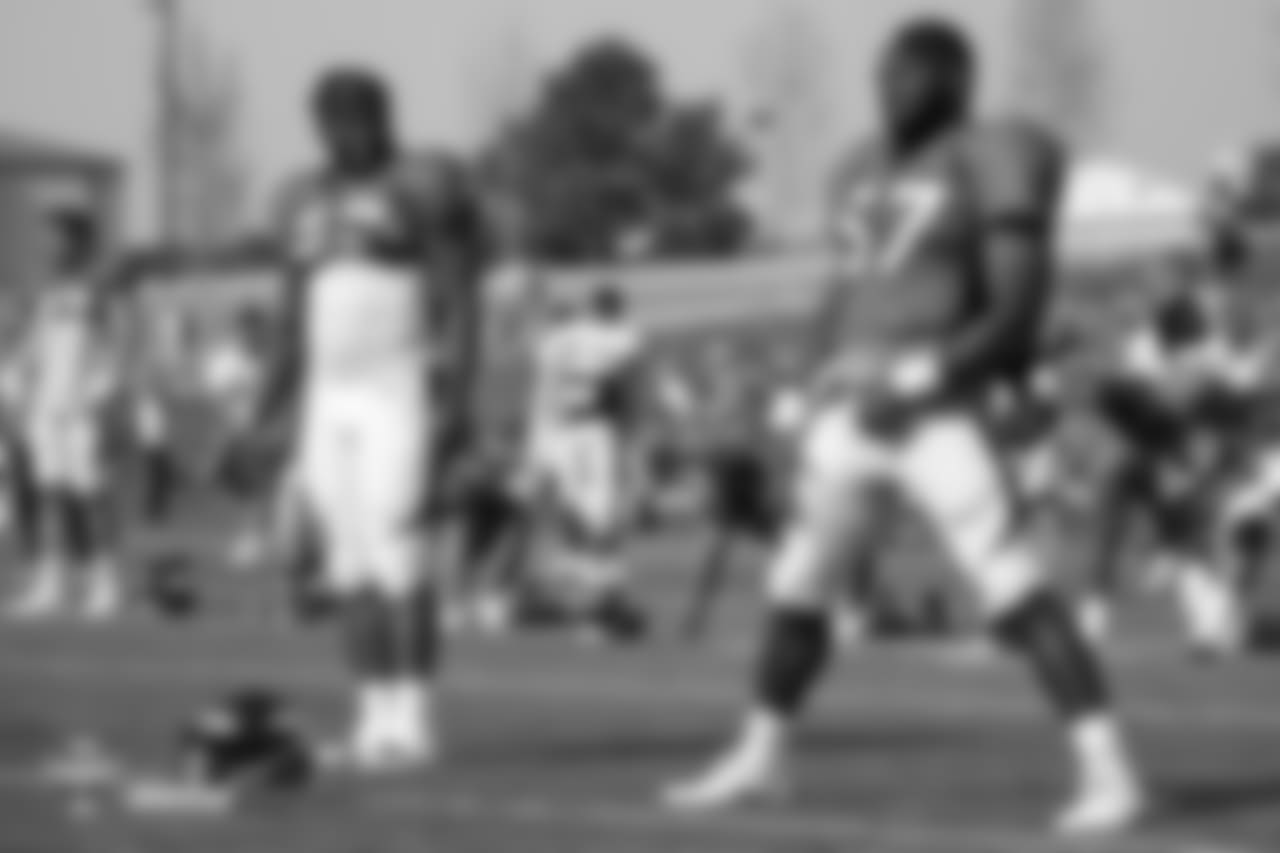 Running back De'Angelo Henderson Sr. (33) and running back Royce Freeman (37) at the fifth day of training camp on August 1, 2018, at UCHealth Training Center.