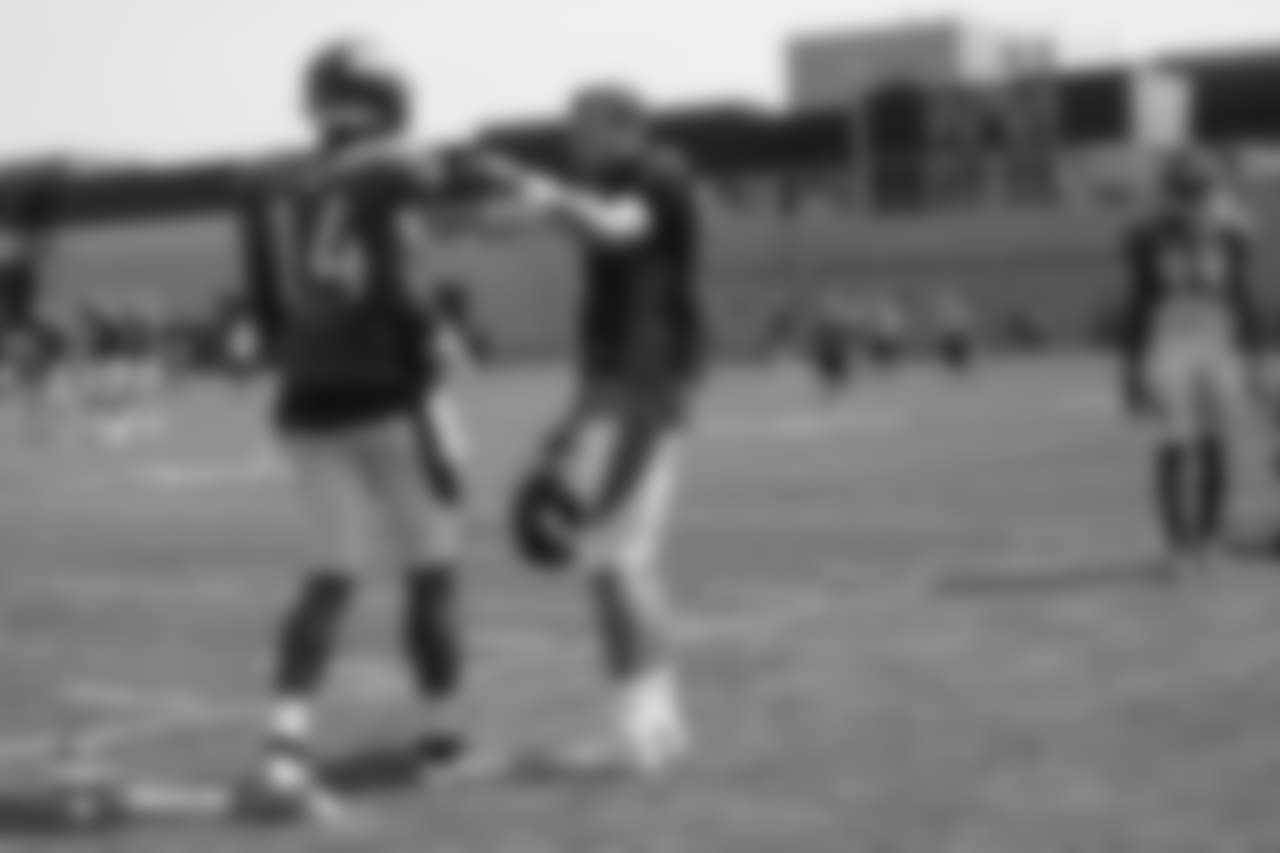 Quarterback Case Keenum (4) talks with wide receiver Courtland Sutton (14) during the ninth day of training camp on August 7, 2018, at UCHealth Training Center.