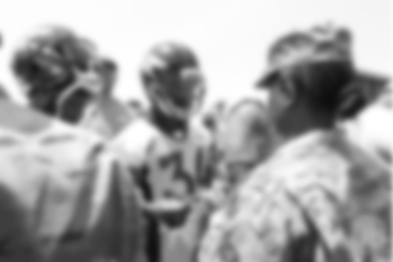 Safety Will Parks (34) meets military members of the Colorado Air National Guard and the U.S. Army after practice on June 12, 2018. The meet-and-greet was part of an event hosting servicemen and servicewomen with USAA and the Broncos Womens Organization.