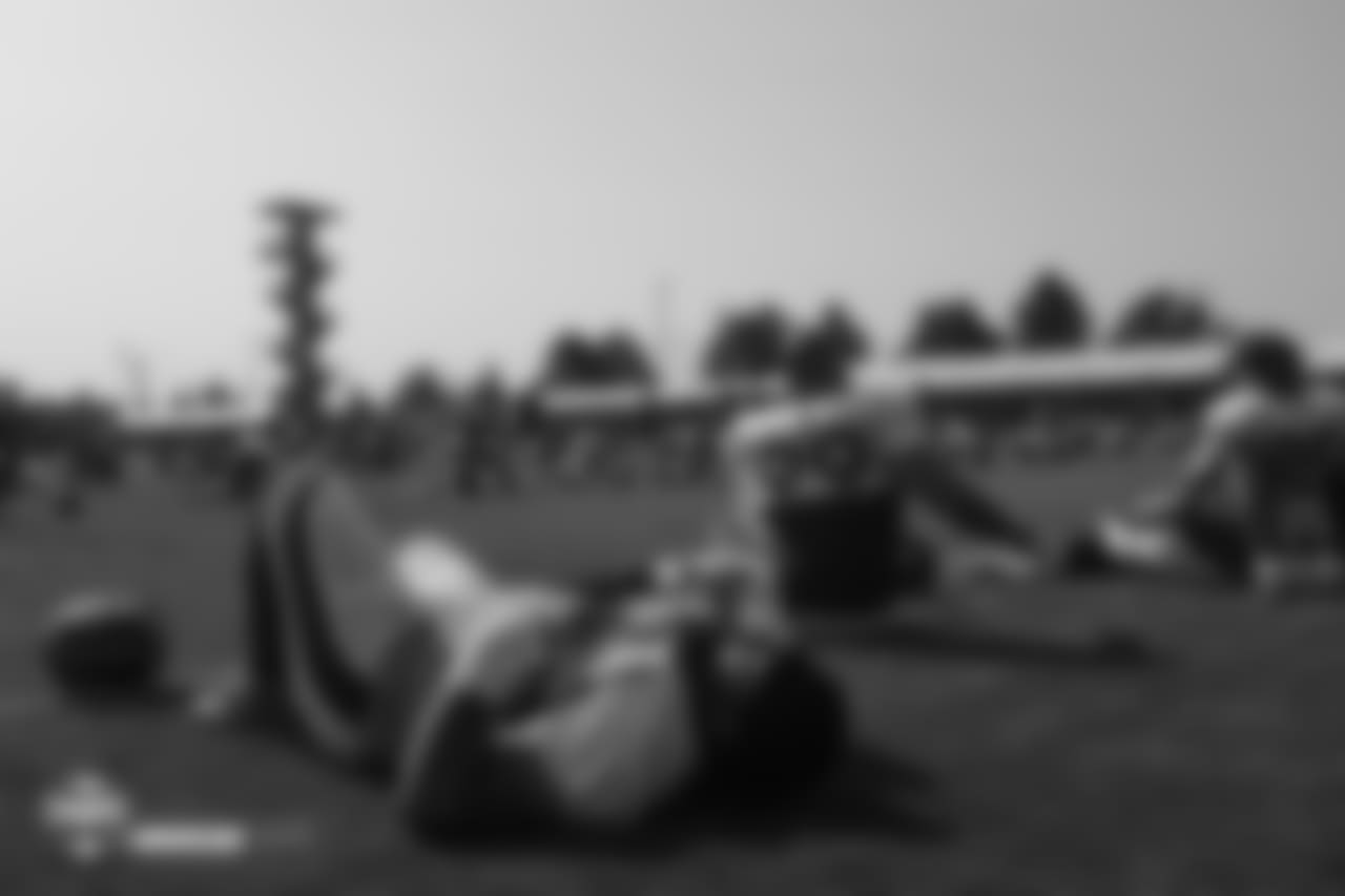 Nose tackle Domata Peko Sr. (94) takes a moment to rest while he pulls on his jersey before the stretching period during the ninth day of training camp on August 7, 2018, at UCHealth Training Center.