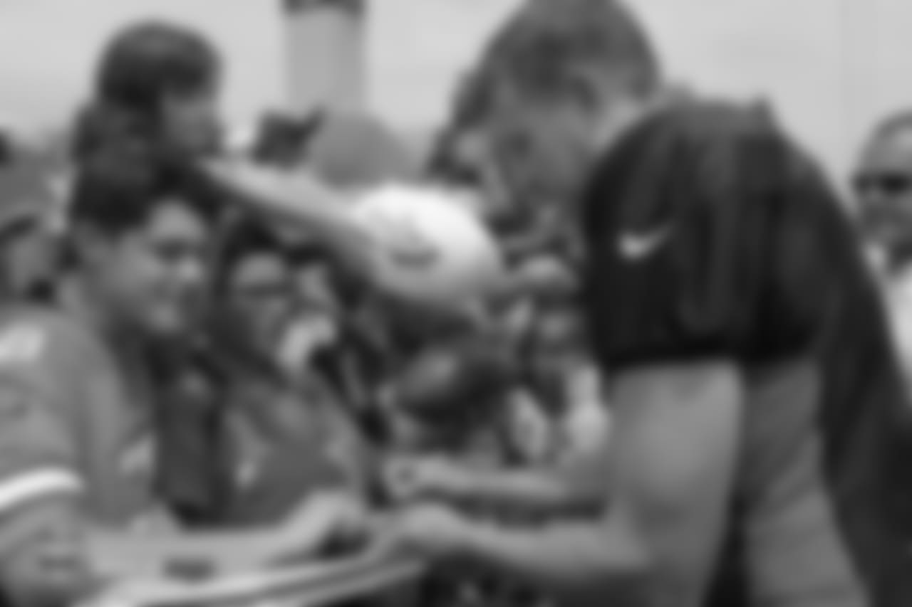Quarterback Case Keenum (4) signs autographs for children at the sixth day of training camp on August 3, 2018, at UCHealth Training Center. Friday was Kids Day.