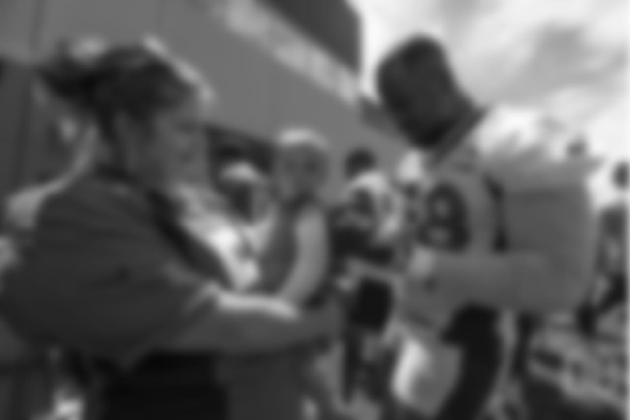 outside linebacker Von Miller (58) meets patients from Children's Hospital Colorado's burn unit after the final day of OTAs on June 7, 2018 at UCHealth Training Center.