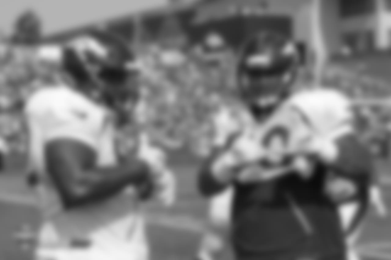 Defensive end Zach Kerr (92) and nose tackle Kyle Peko (90) during the ninth day of training camp on August 7, 2018, at UCHealth Training Center.