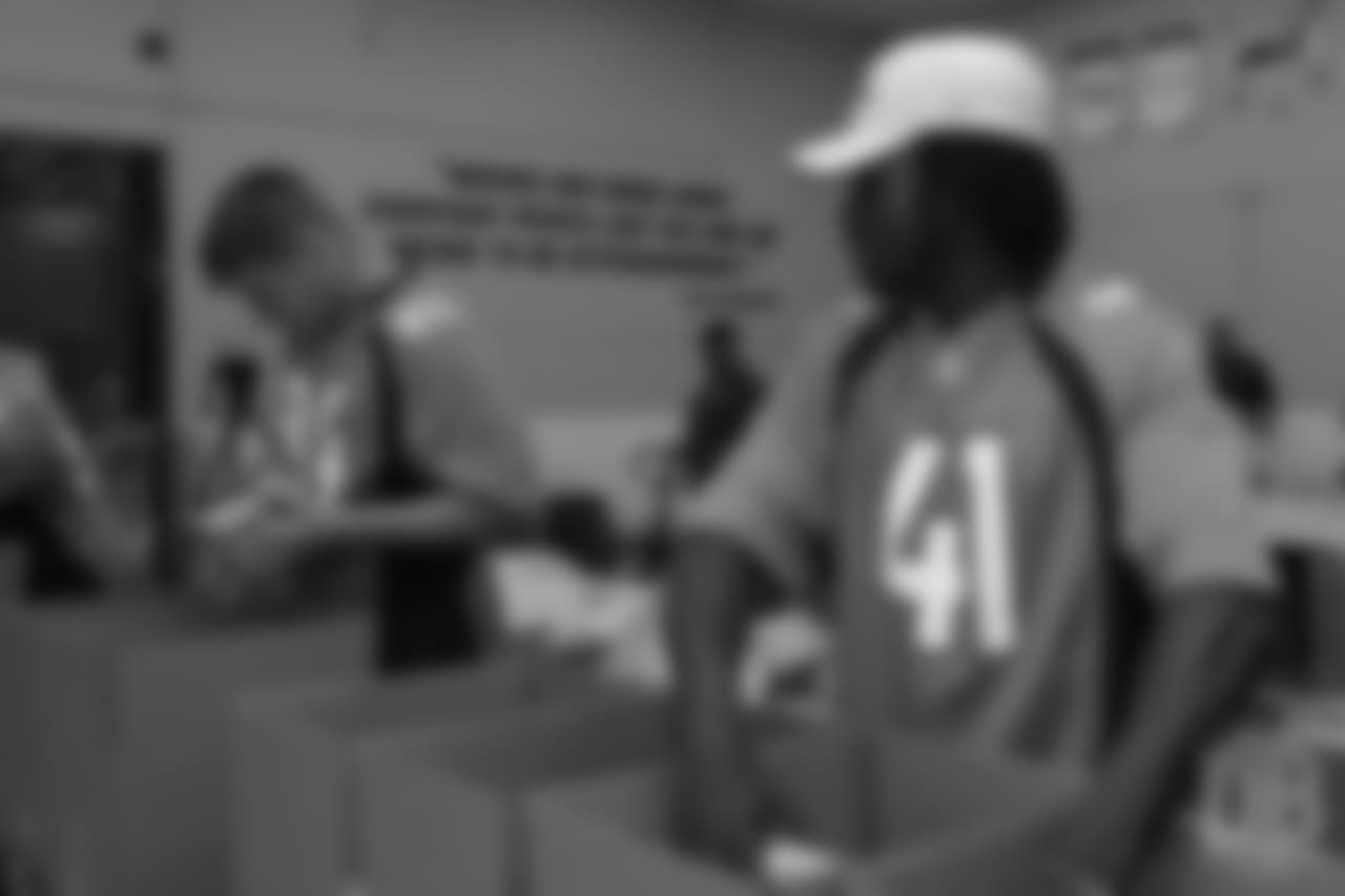 Cornerback Isaac Yiadom (41) packs food at the Food Bank of the Rockies at the Broncos' third annual Rookie Community Service Day on June 11, 2018.