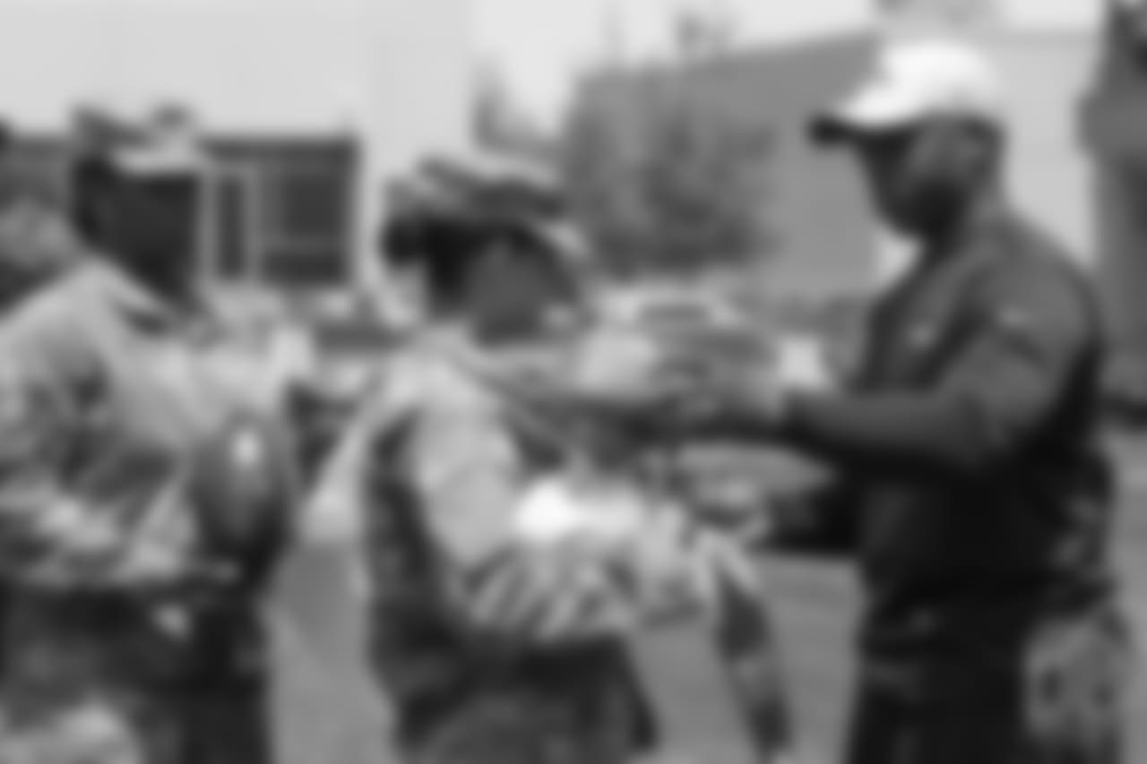 Head Coach Vance Joseph meets military members of the Colorado Air National Guard and the U.S. Army after practice on June 12, 2018. The meet-and-greet was part of an event hosting servicemen and servicewomen with USAA and the Broncos Womens Organization.