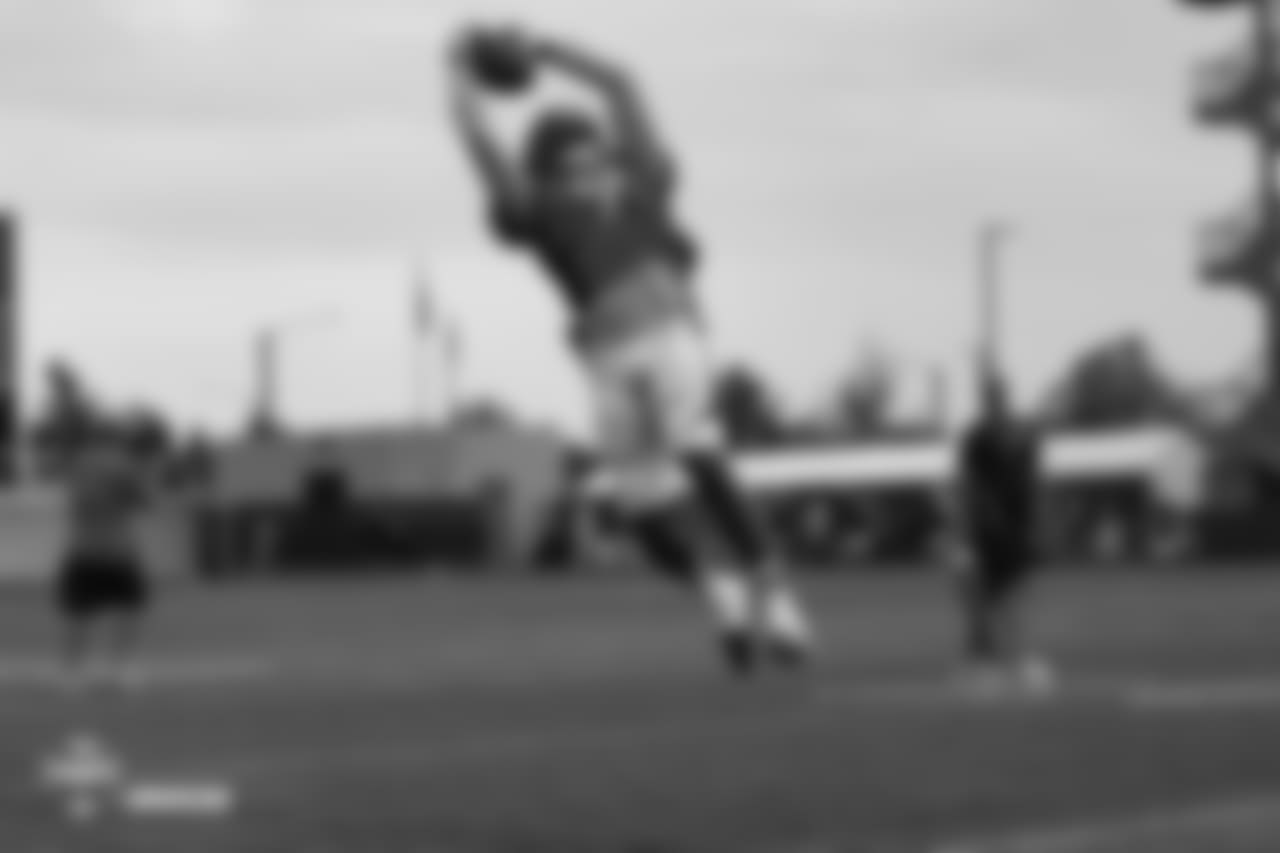 Wide receiver John Diarse (9) jumps to making a leaping grab at the sixth day of training camp on August 3, 2018, at UCHealth Training Center.