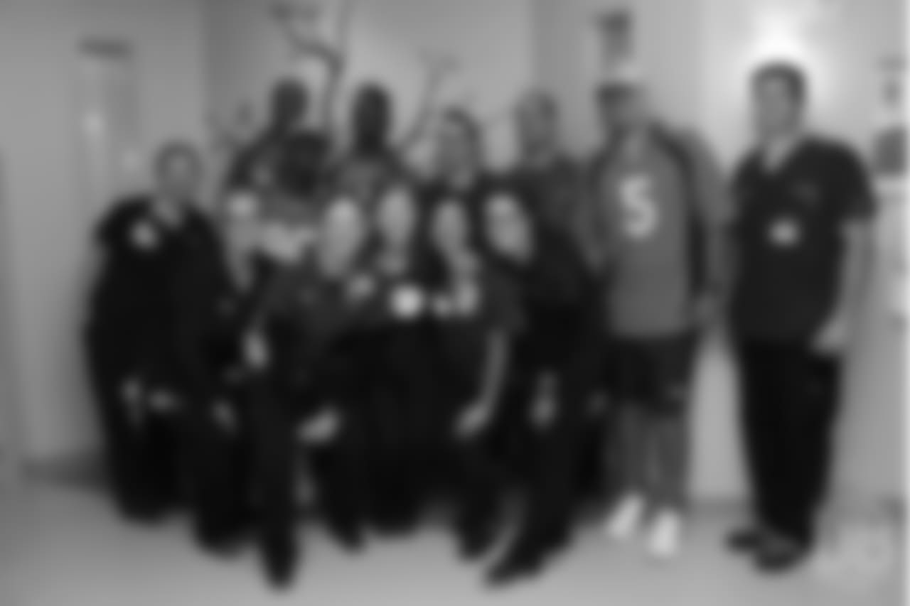 Wide receiver Courtland Sutton (14), wide receiver Jimmy Williams (85), wide receiver DaeSean Hamilton (17) and quarterback Nick Stevens (5) pose for a photo with hospital staff at UCHealth's University of Colorado Hospital at the Broncos' third annual Rookie Community Service Day on June 11, 2018.