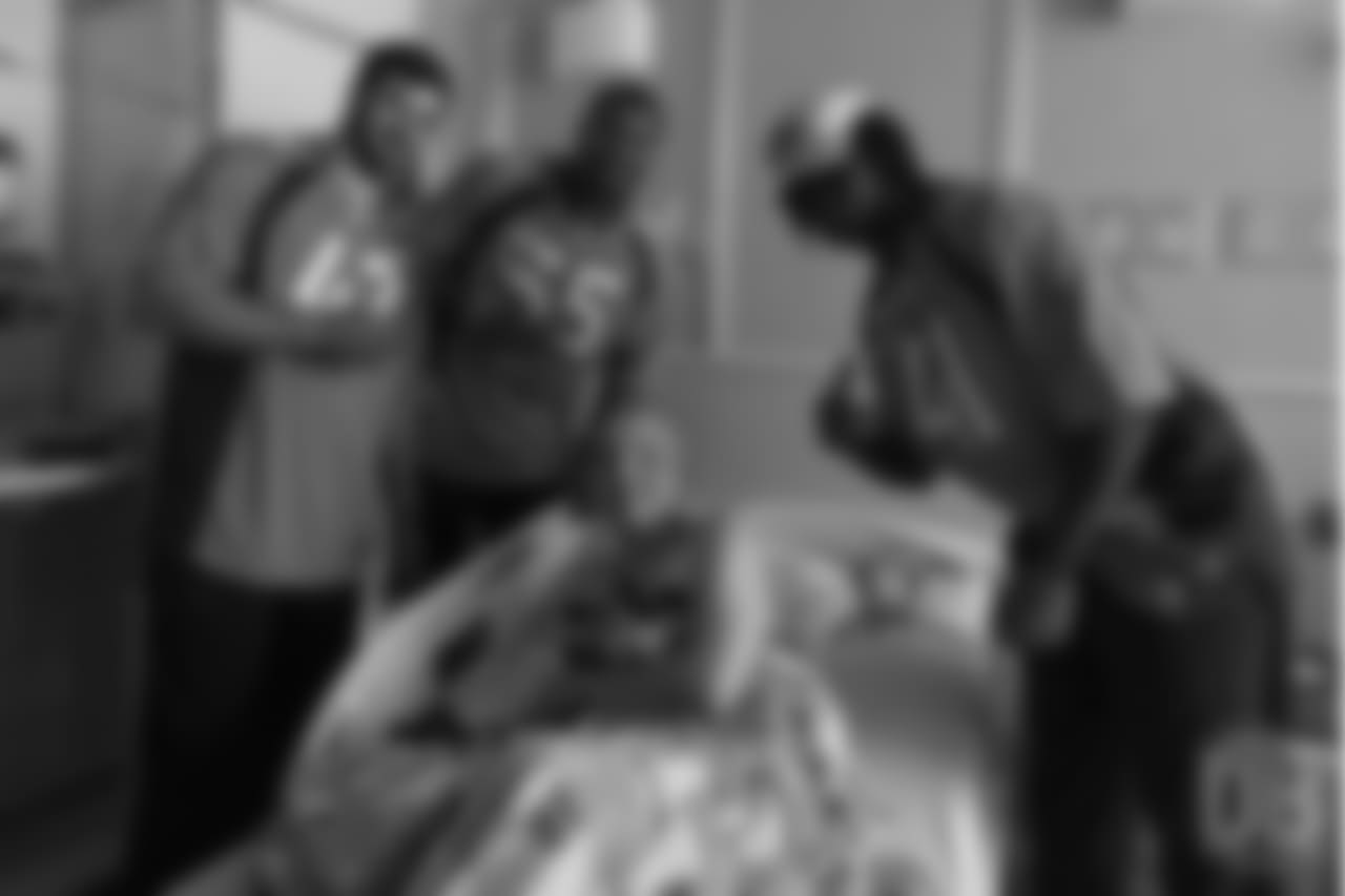 Cornerback Isaac Yiadom (41), outside linebacker Bradley Chubb (55) and inside linebacker Josey Jewell (47) meet a patient at Children's Hospital Colorado at the Broncos' third annual Rookie Community Service Day on June 11, 2018. at Children's Hospital Colorado at the Broncos' third annual Rookie Community Service Day on June 11, 2018.