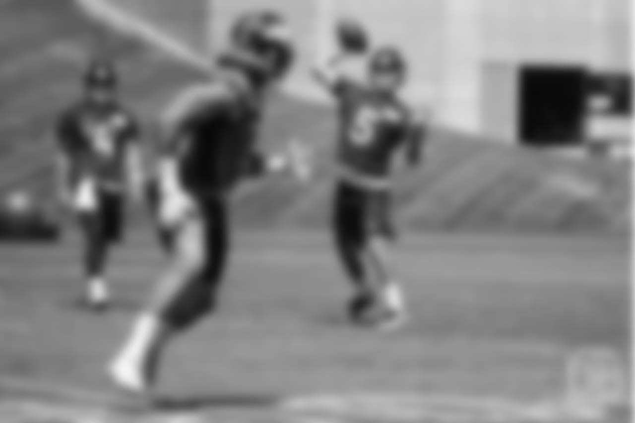quarterback Nick Stevens (5) throws a pass to running back Phillip Lindsay (2) during the 10th and final day of OTAs on June 7, 2018 at UCHealth Training Center.