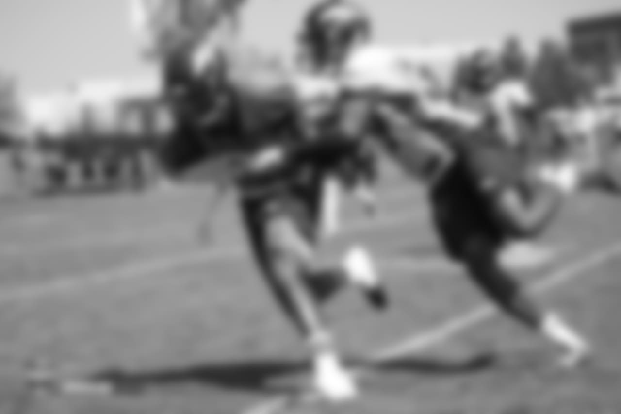 Wide receiver John Diarse (9) tries to turn upfield as cornerback Michael Hunter (39) tries to hold him back during the 11th day of training camp on August 9, 2018, at UCHealth Training Center.