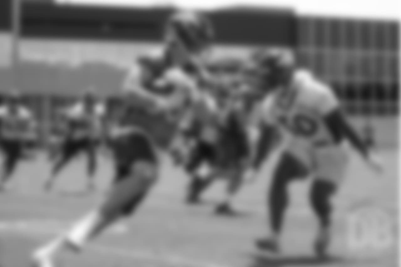 tight end Matt LaCosse (83) tries to elude safety Jordan Moore (30) during practice at the eighth day of OTAs on June 5, 2018.