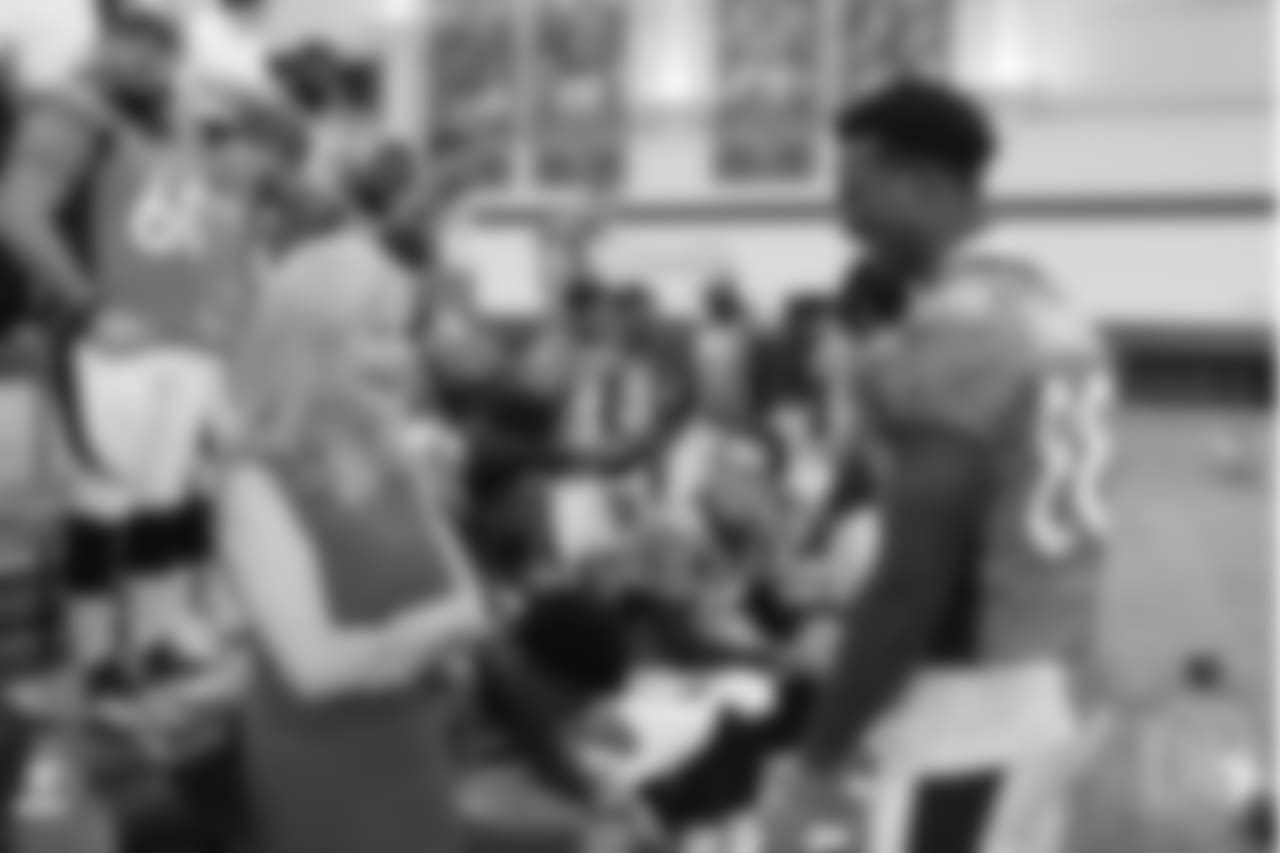 Annabel Bowlen, representing Owner Pat Bowlen, talks with Denver Broncos wide receiver Demaryius Thomas (88) before the team photo on Oct. 4, 2017.