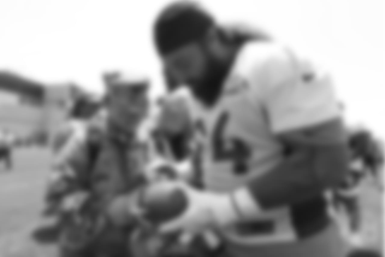 Nose tackle Domata Peko Sr. (94) meets military members of the Colorado Air National Guard and the U.S. Army after practice on June 12, 2018. The meet-and-greet was part of an event hosting servicemen and servicewomen with USAA and the Broncos Womens Organization.