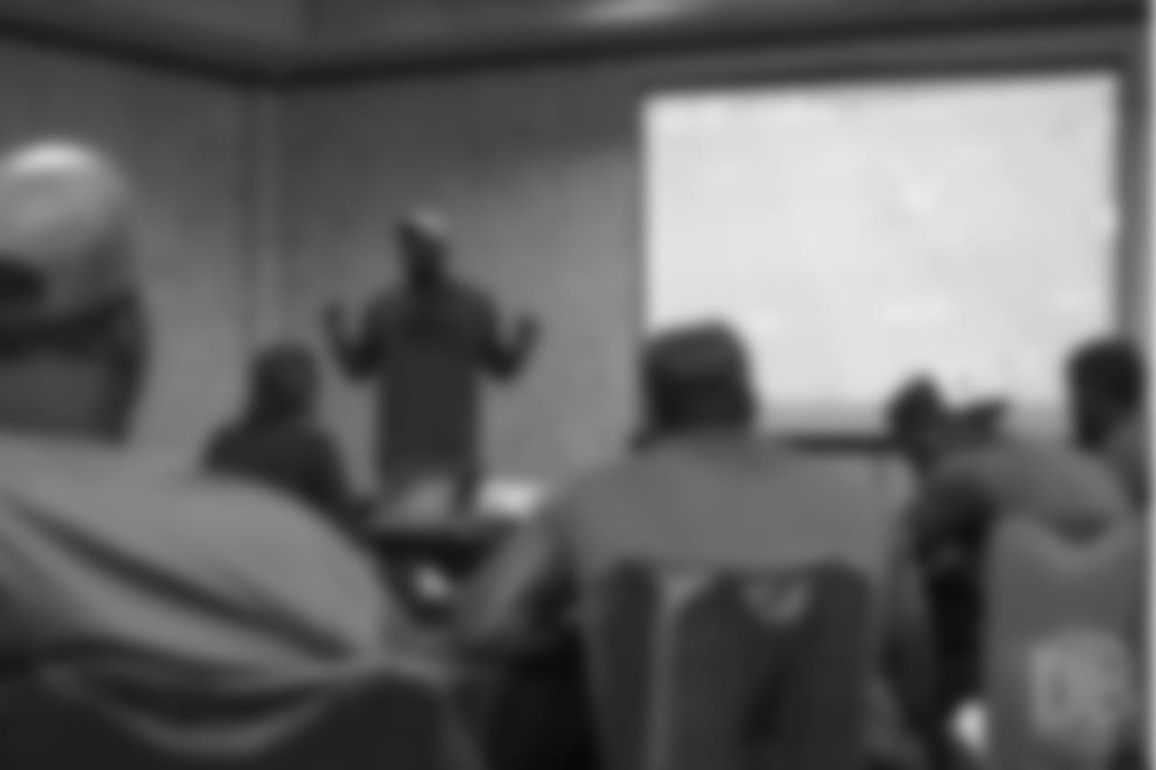 Von Miller reviews player film at Von Miller's Pass Rush Summit, which included hands-on instruction and drills, on June 28, 2018.