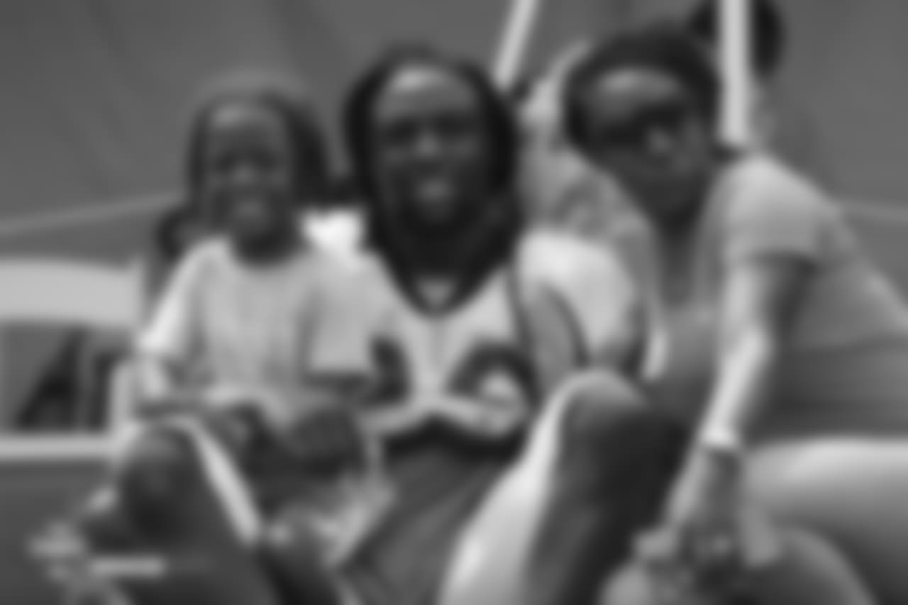 Safety Jamal Carter (20) with his wife and son after the sixth day of training camp on August 3, 2018, at UCHealth Training Center.