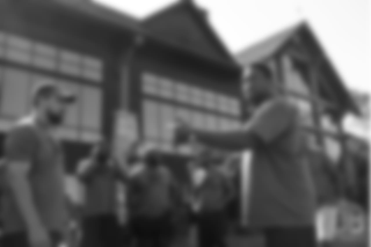 Warren Sapp talks to the group during the on-field portion of Von Miller's Pass Rush Summit, which included hands-on instruction and drills, on June 28, 2018.