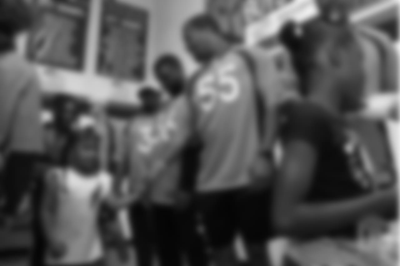 Outside linebacker Bradley Chubb (55) shakes hands with a young girl at the Denver Broncos Boys & Girls Club at the Broncos' third annual Rookie Community Service Day on June 11, 2018.