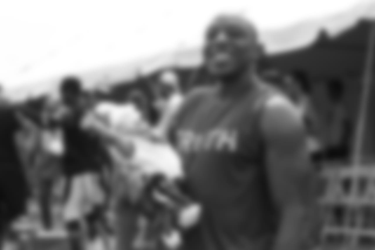Cornerback Chris Harris Jr. (25) poses for a photo with his infant daughter, Aliyah, at the sixth day of training camp on August 3, 2018, at UCHealth Training Center.