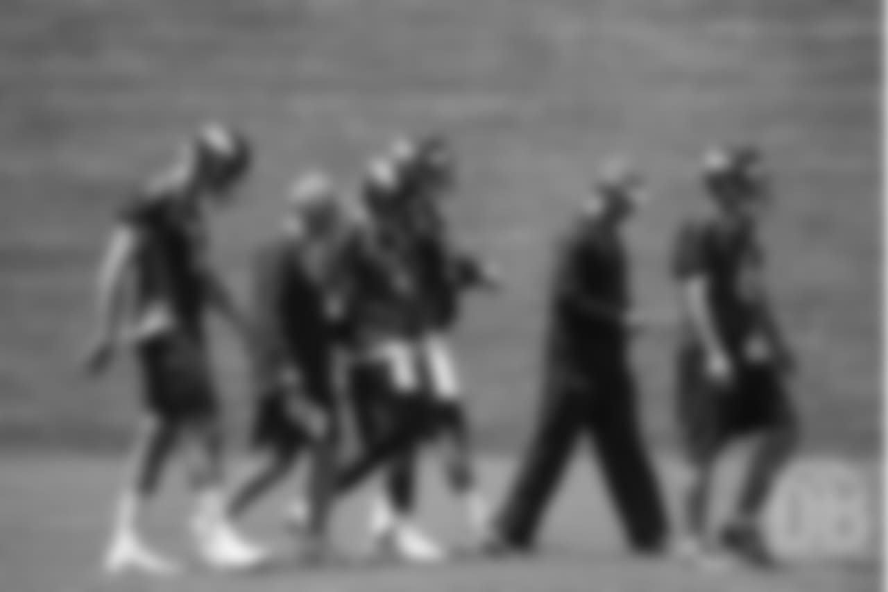 Quarterbacks Coach Mike Sullivan and Offensive Assistant/Quarterbacks Coach Klint Kubiak work with their position group, including (from left to right) quarterback Paxton Lynch (12), quarterback Case Keenum (4), quarterback Nick Stevens (5) and quarterback Chad Kelly (6).