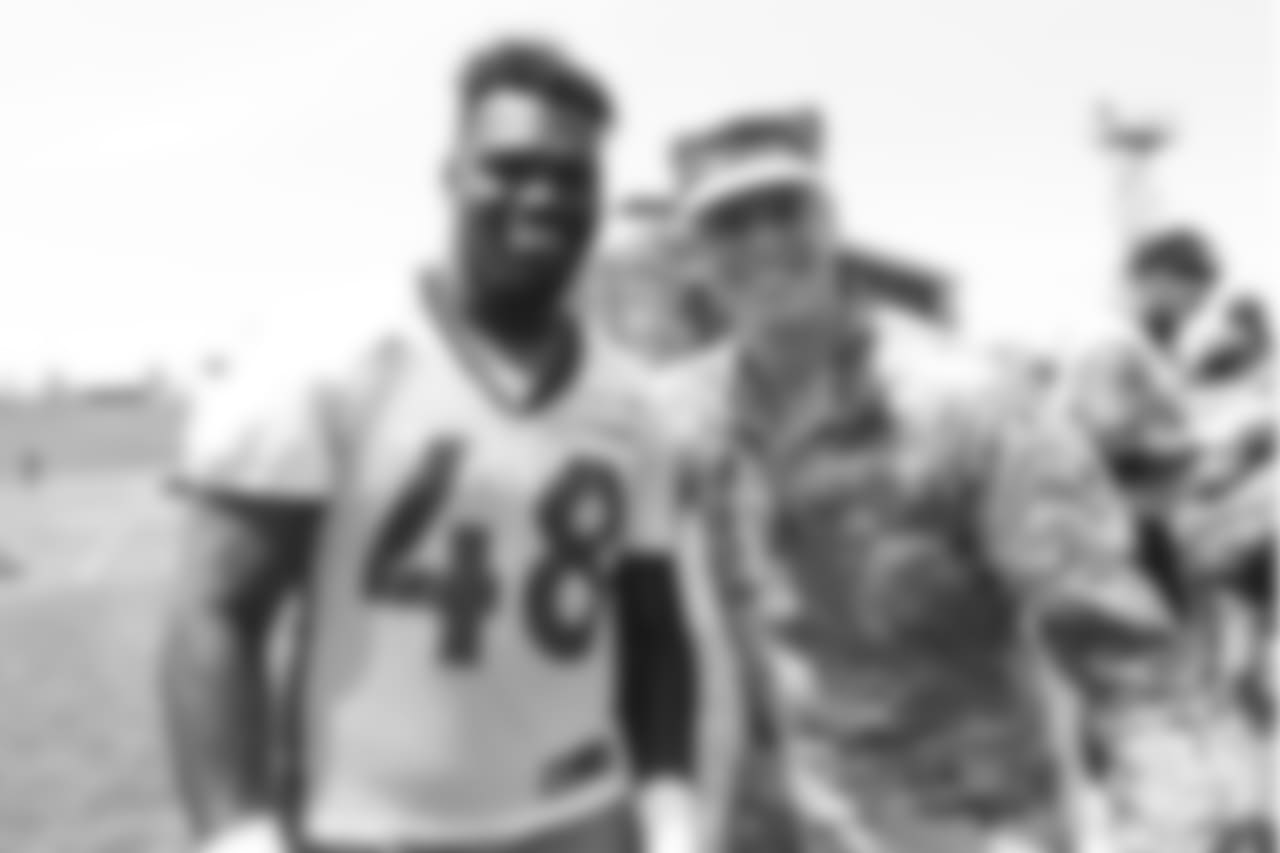 Outside linebacker Shaquil Barrett (48) meets military members of the Colorado Air National Guard and the U.S. Army after practice on June 12, 2018. The meet-and-greet was part of an event hosting servicemen and servicewomen with USAA and the Broncos Womens Organization.