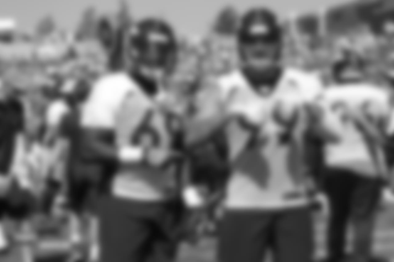 Defensive end Antonio Simmons (69) and defensive end Adam Gotsis (99), both former Georgia Tech Yellow Jackets, during the 11th day of training camp on August 9, 2018, at UCHealth Training Center.