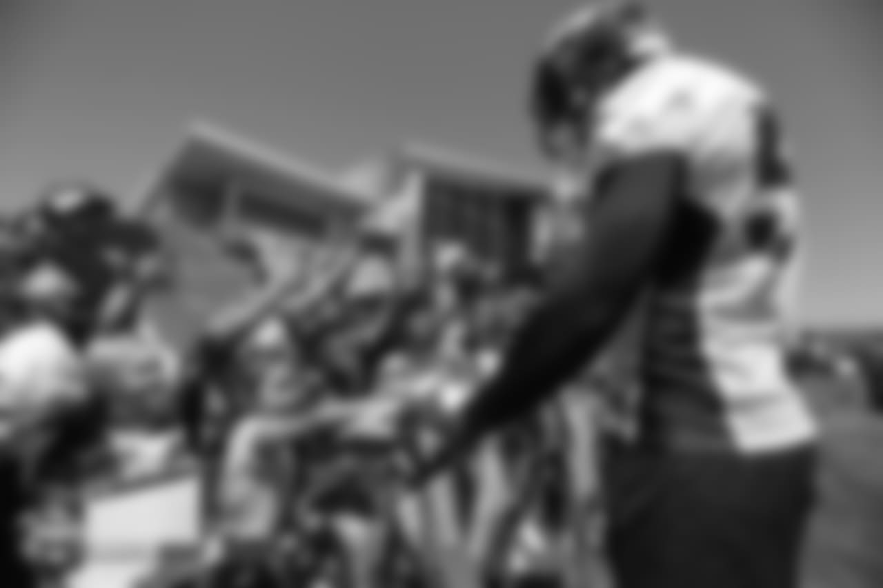 Outside linebacker Von Miller (58) signs autographs after the 11th day of training camp on August 9, 2018, at UCHealth Training Center.