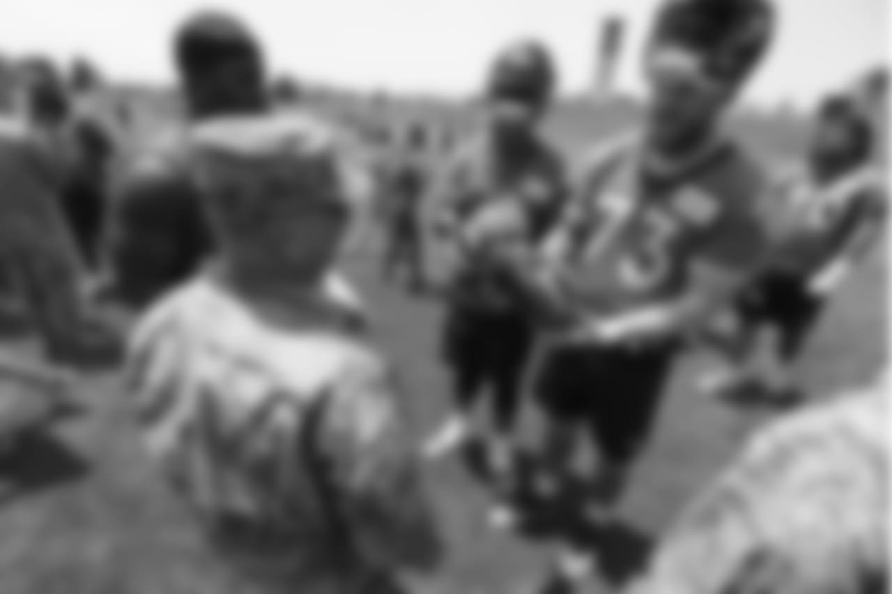 Tackle Andreas Knappe (73) and other offensive linemen meet military members of the Colorado Air National Guard and the U.S. Army after practice on June 12, 2018. The meet-and-greet was part of an event hosting servicemen and servicewomen with USAA and the Broncos Womens Organization.