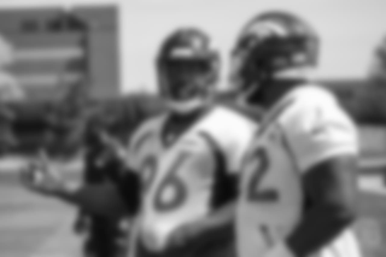 defensive end Shelby Harris (96) talks with defensive end Zach Kerr (92) on the sideline at the ninth day of OTAs on June 6, 2018 at UCHealth Training Center.
