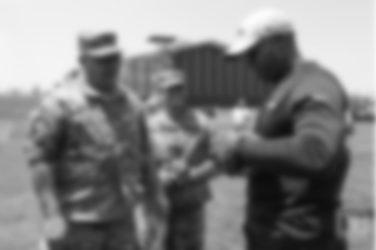 Head Coach Vance Joseph meets military members of the Colorado Air National Guard and the U.S. Army after practice on June 12, 2018. The meet-and-greet was part of an event hosting servicemen and servicewomen with USAA and the Broncos Womens Organization.