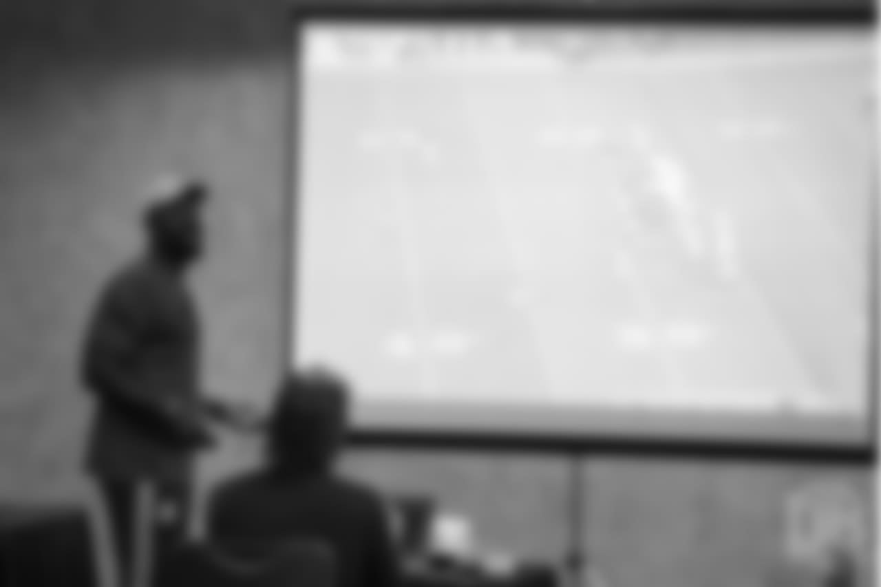 Von Miller reviews player film at Von Miller's Pass Rush Summit, which included hands-on instruction and drills, on June 28, 2018.
