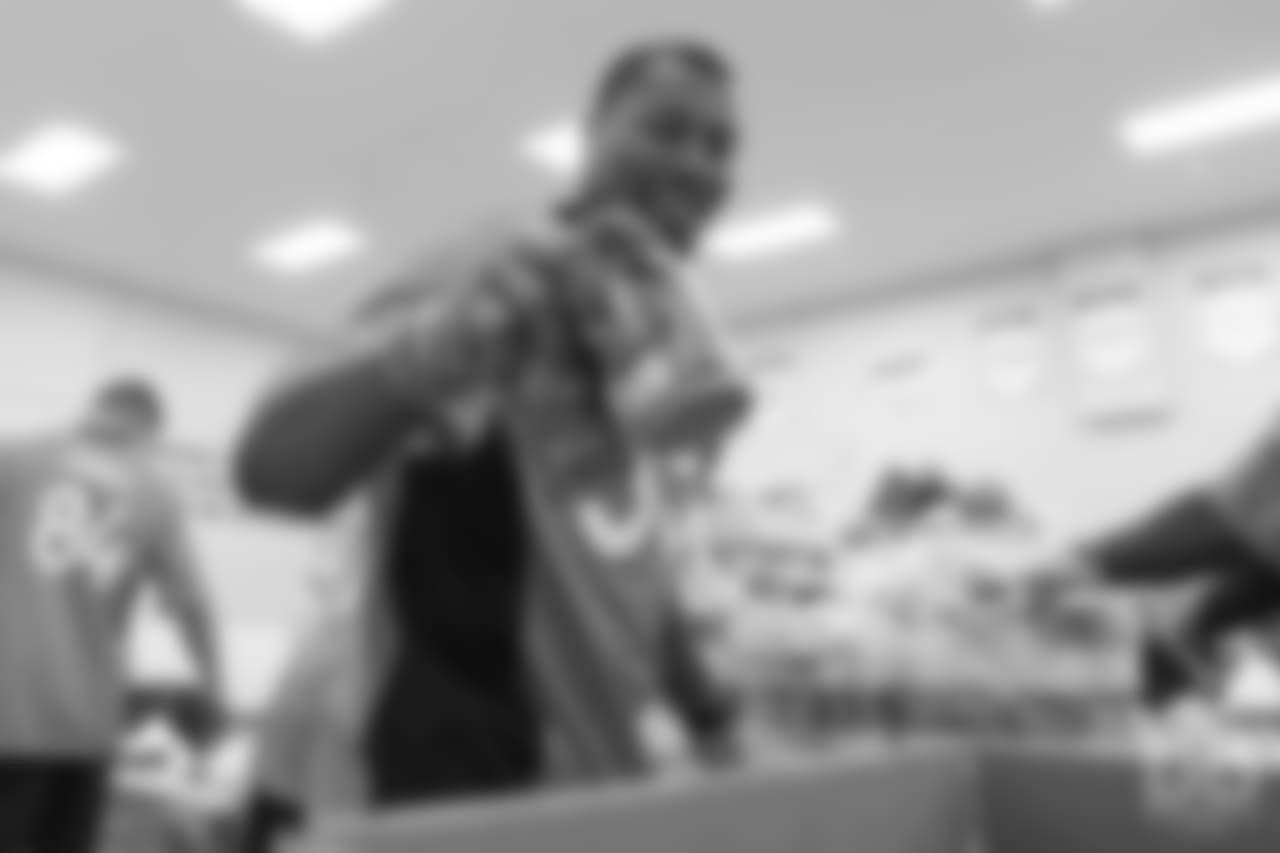 Outside linebacker Bradley Chubb (55) packs food at the Food Bank of the Rockies at the Broncos' third annual Rookie Community Service Day on June 11, 2018.