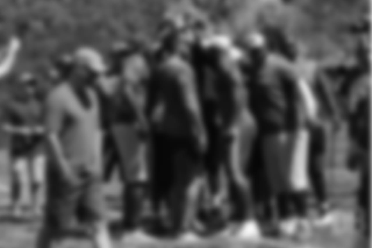 The group huddles up during the on-field portion of Von Miller's Pass Rush Summit, which included hands-on instruction and drills, on June 28, 2018.
