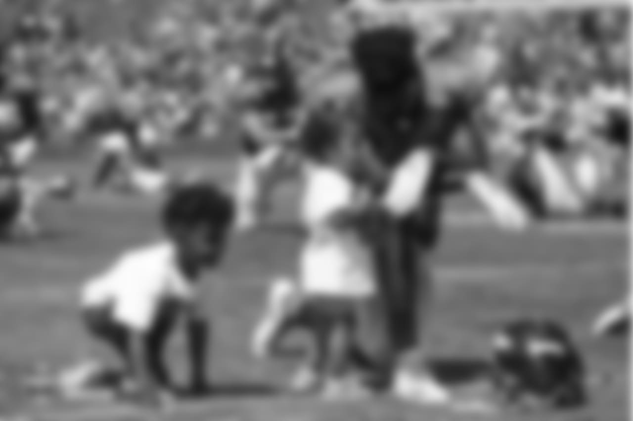 Wide receiver Emmanuel Sanders (10) with his two children, Princeton and Zoie, after the seventh day of training camp on August 4, 2018, at UCHealth Training Center.