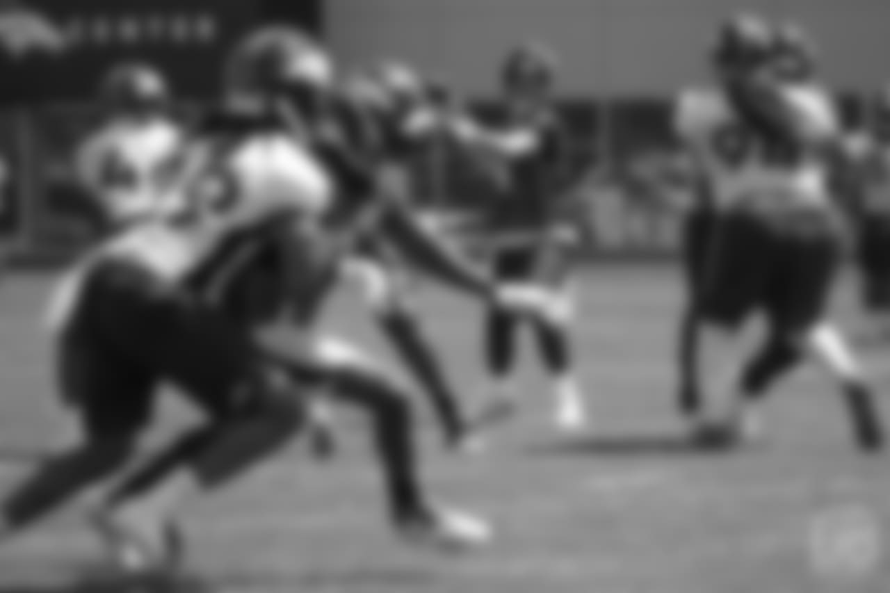 quarterback Case Keenum (4) looks to throw to wide receiver Emmanuel Sanders (10) at the ninth day of OTAs on June 6, 2018 at UCHealth Training Center.