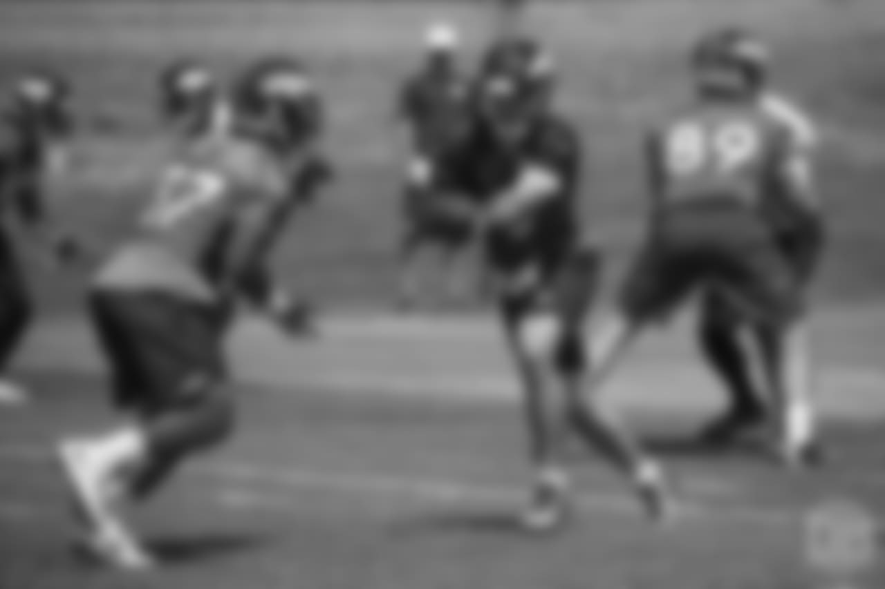 quarterback Chad Kelly (6) hands the ball off to running back Royce Freeman (37) at the ninth day of OTAs on June 6, 2018 at UCHealth Training Center.