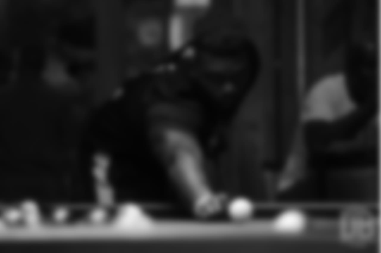 Shaquil Barrett plays pool on the first day of Von Miller's Pass Rush Summit, which included a welcome session and a night of games on June 27, 2018.