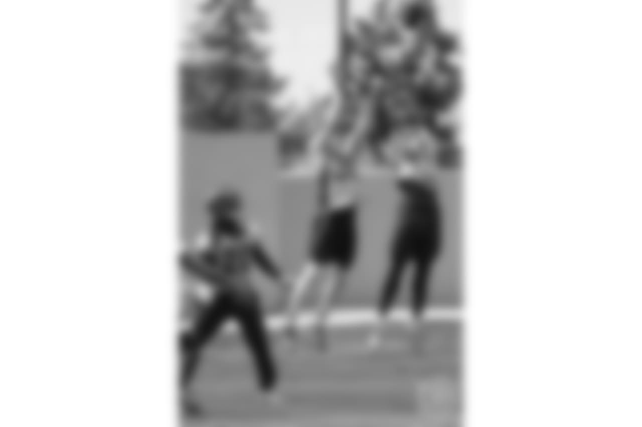 safety Dymonte Thomas (35) and cornerback Isaac Yiadom (41) jump up to knock down a pass during the 10th and final day of OTAs on June 7, 2018 at UCHealth Training Center.