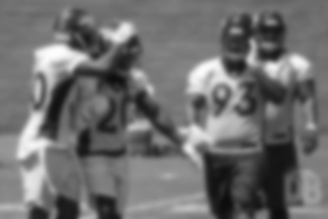 safety Jamal Carter (20) celebrates an interception with safety Jordan Moore (30) during practice at the eighth day of OTAs on June 5, 2018.