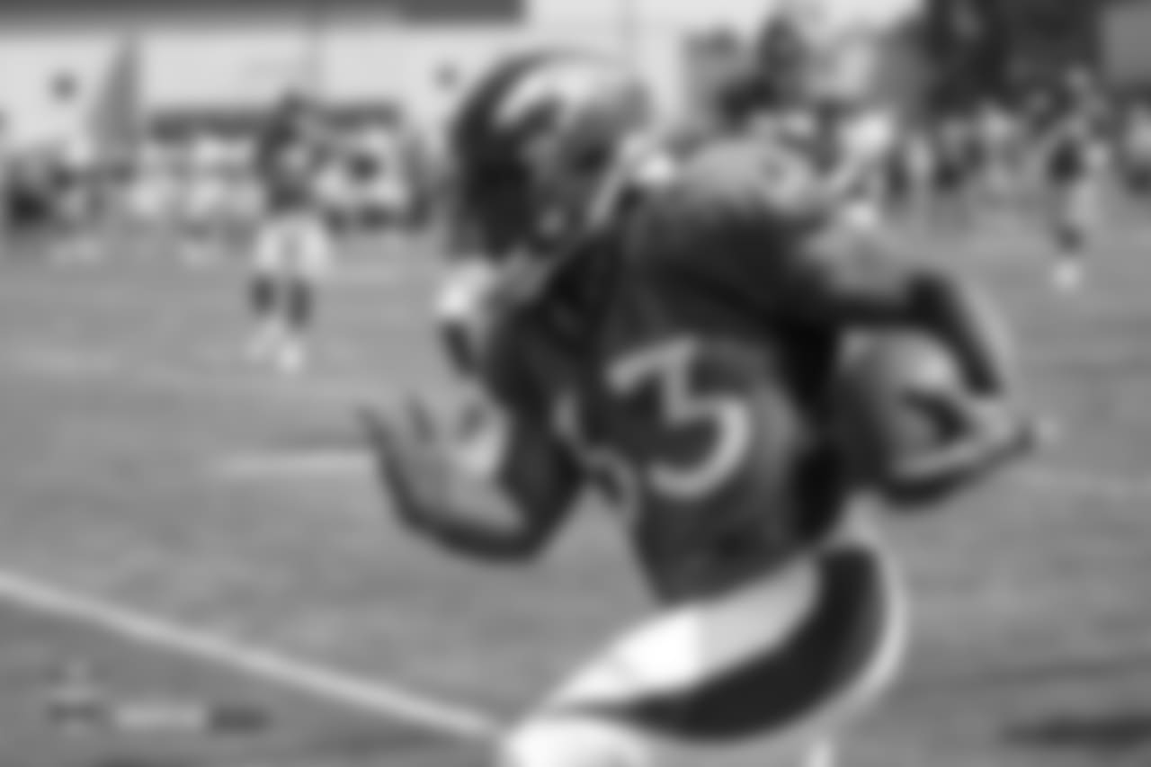 Running back De'Angelo Henderson Sr. (33) during the ninth day of training camp on August 7, 2018, at UCHealth Training Center.