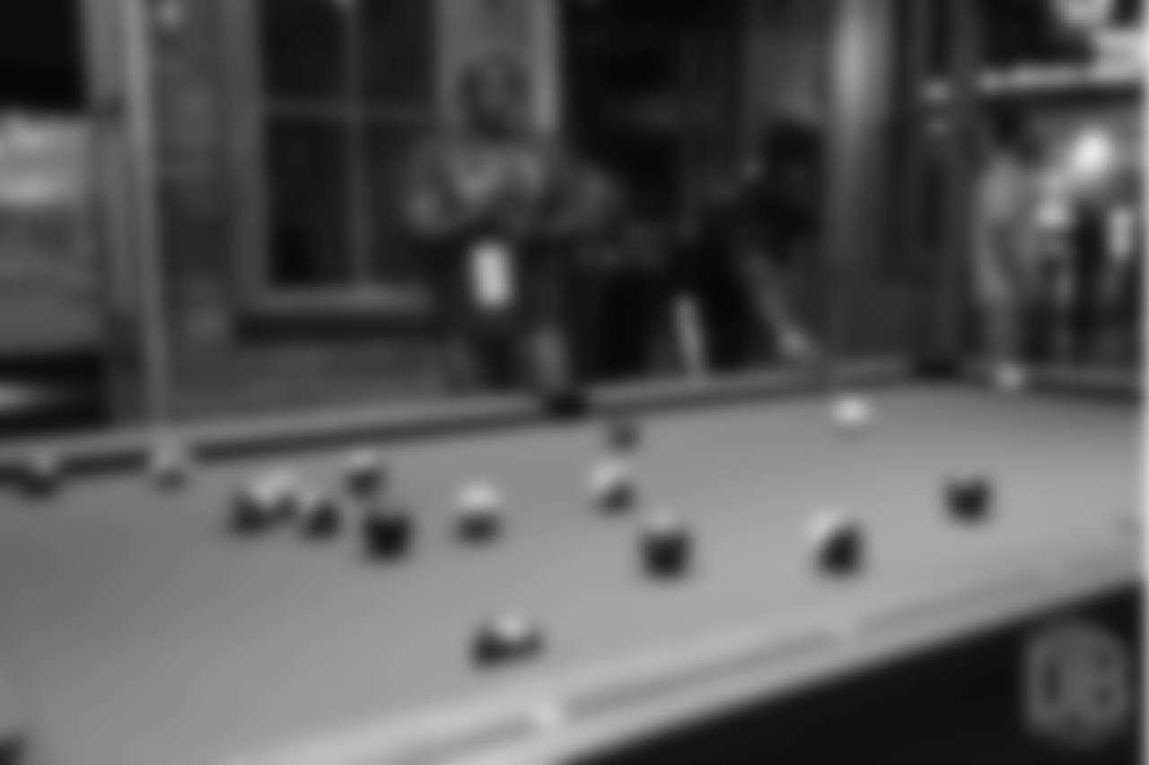 Von Miller's father and Shaquil Barrett play pool the first day of Von Miller's Pass Rush Summit, which included a welcome session and a night of games on June 27, 2018.