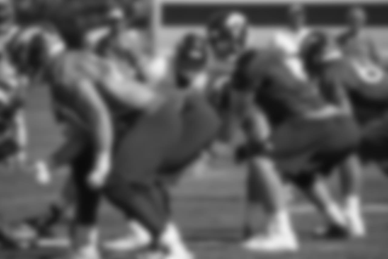 Outside linebacker Von Miller (58) looks over the line of scrimmage at quarterback Case Keenum (4) during the 11th day of training camp on August 9, 2018, at UCHealth Training Center.
