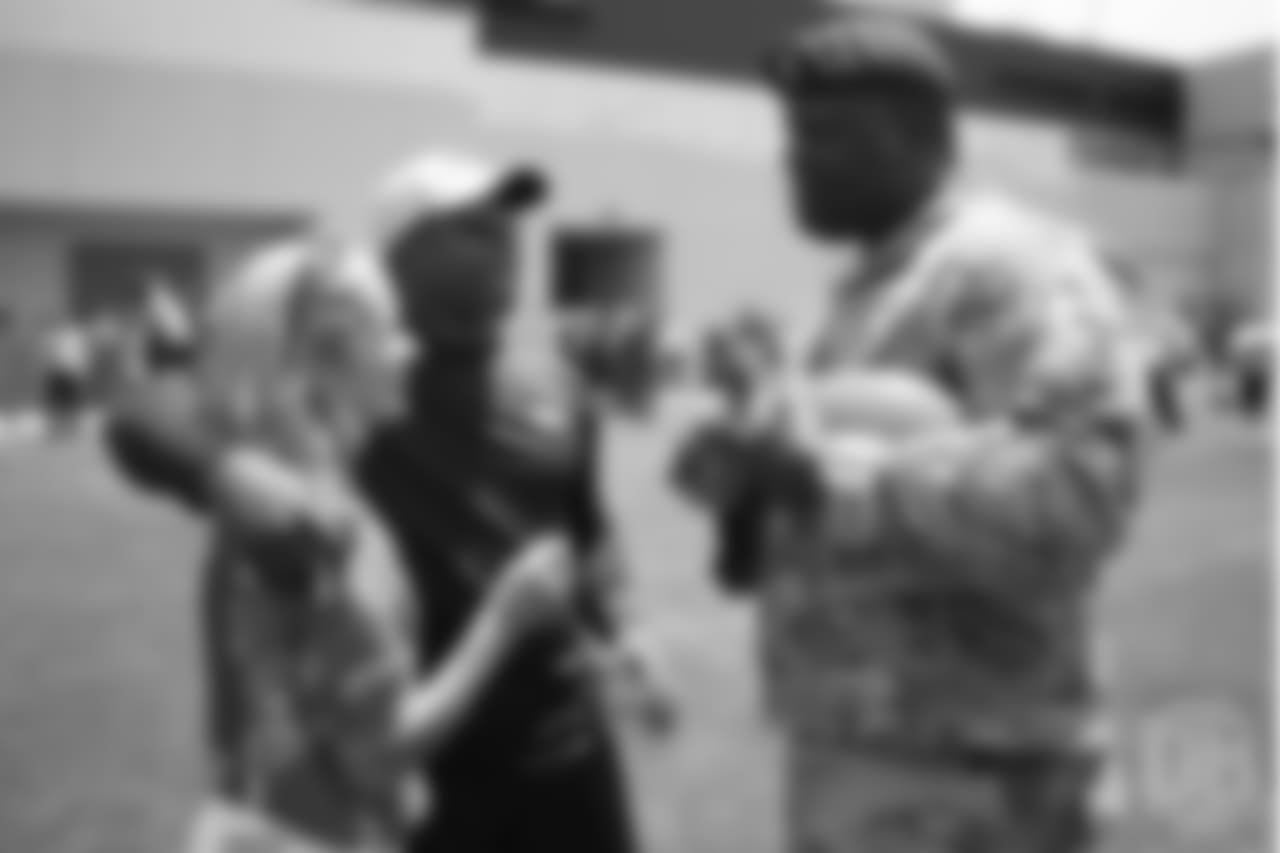 Head Coach Vance Joseph and his wife Holly greets U.S. Army chaplain Darius Holland after practice on June 12, 2018. Holland and Joseph are friends and were teammates during their days on the Colorado Buffaloes football team. The meet-and-greet with Holland and other members of the Army and Colorado Air National Guard was part of an event hosting servicemen and servicewomen with USAA and the Broncos Womens Organization.
Photo by Gabriel Christus