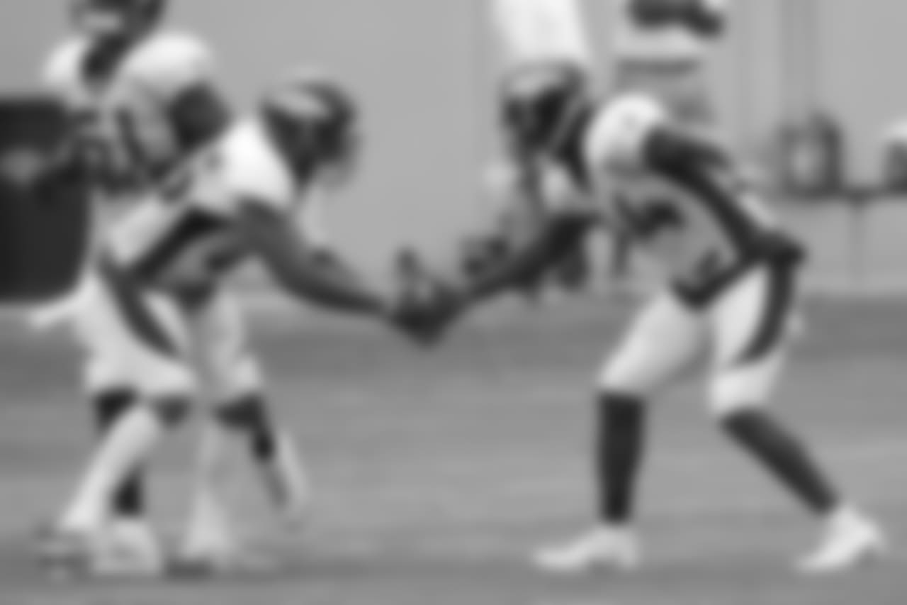 Safety Will Parks (34) celebrates his interception with cornerback Chris Harris Jr. (25) at the sixth day of training camp on August 3, 2018, at UCHealth Training Center.